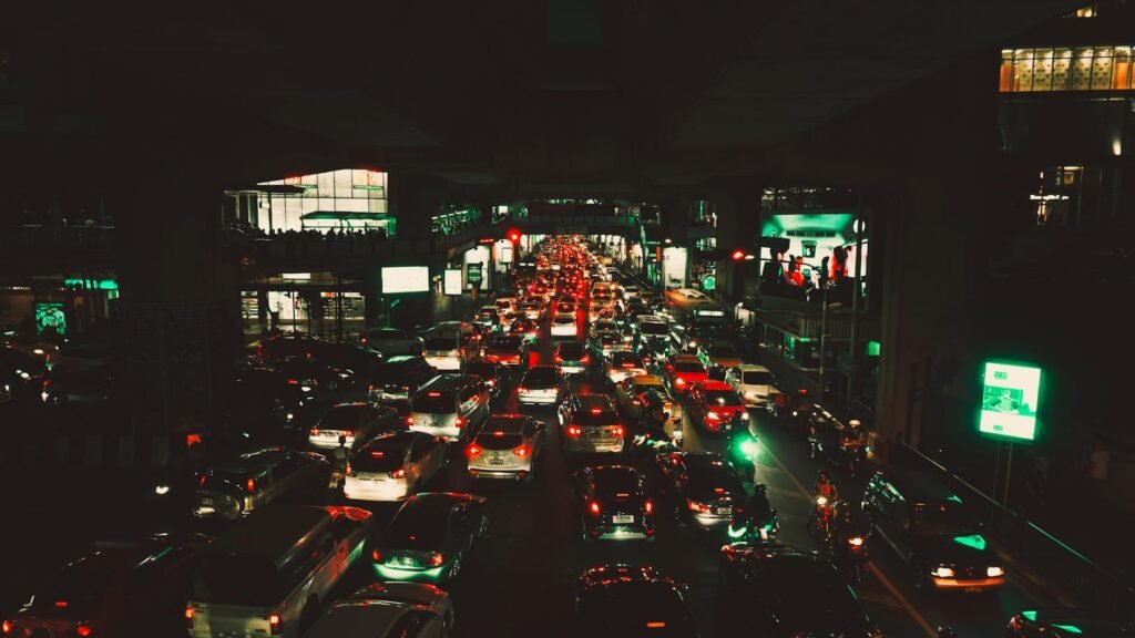 car passing through road beside building
